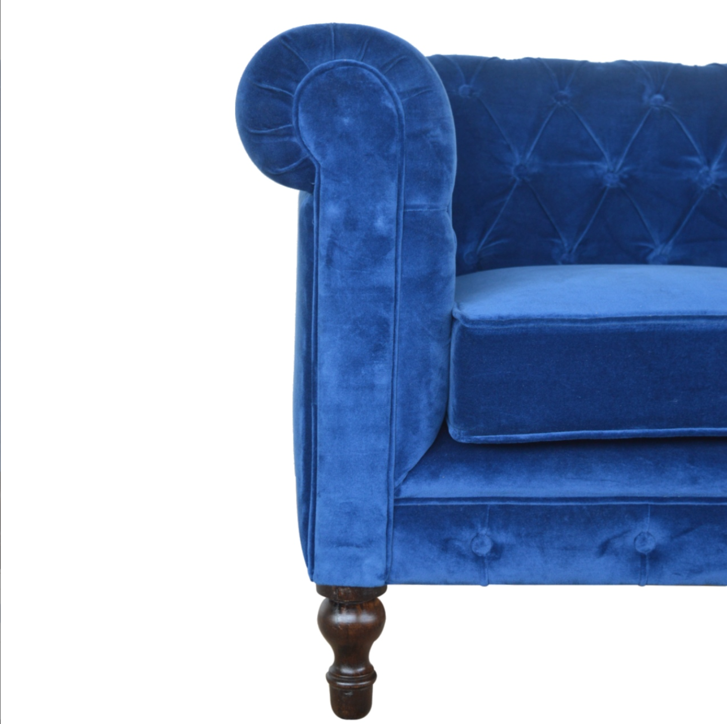 Detail of Hand-Turned Mango Wood Legs on Royal Blue Velvet Chesterfield Sofa