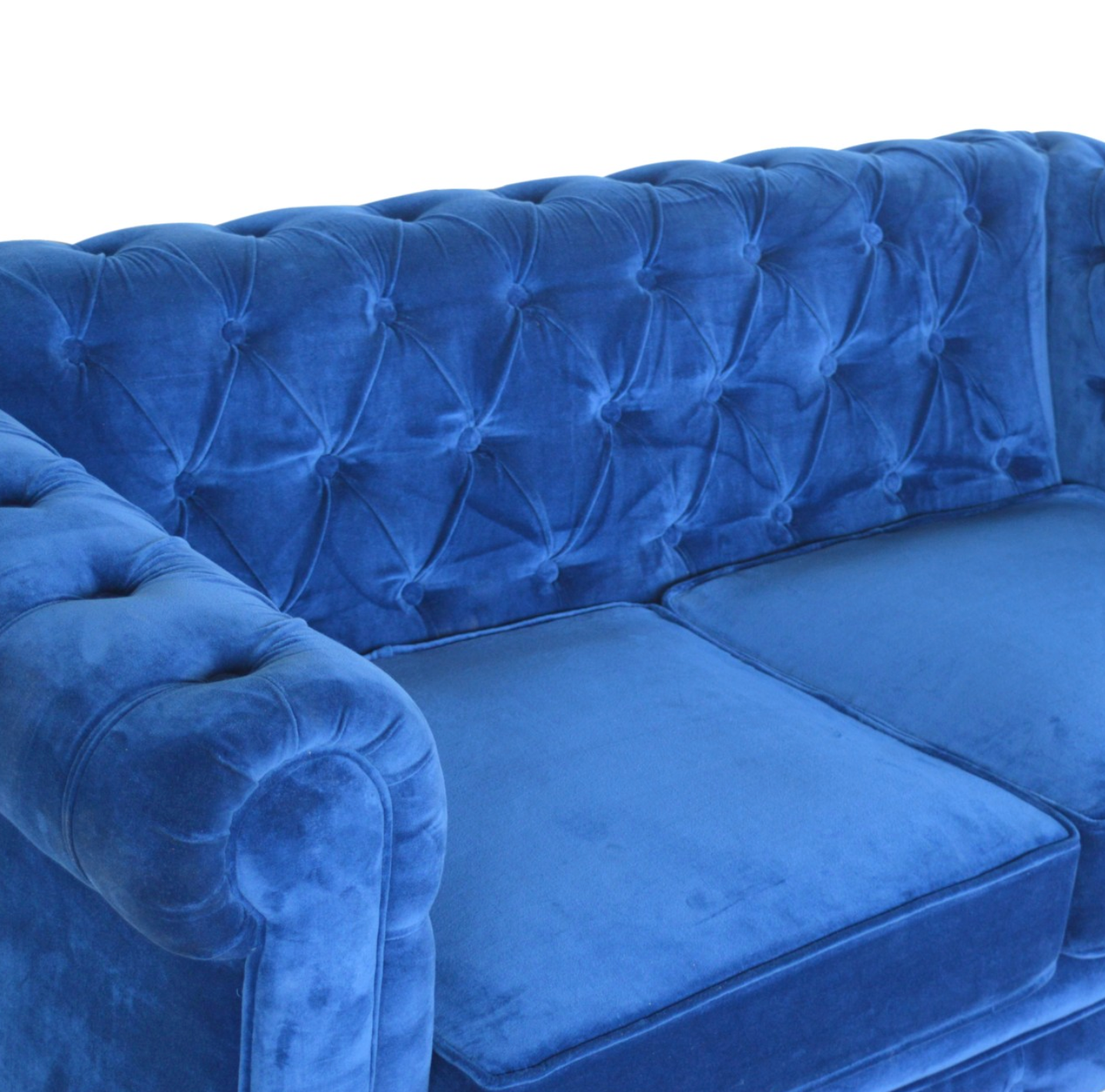 Close-up of Royal Blue Velvet Upholstery and Tufting Detail on Chesterfield Sofa
