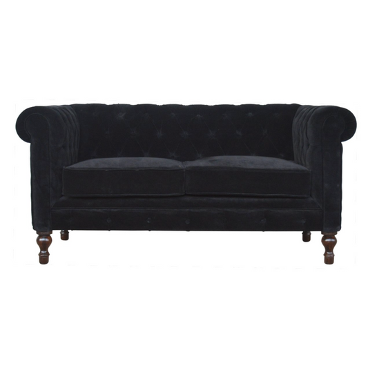 Nørthhaus Black Velvet Chesterfield Sofa Front View with Deep Button Tufting and Classic Sheltering Arms

